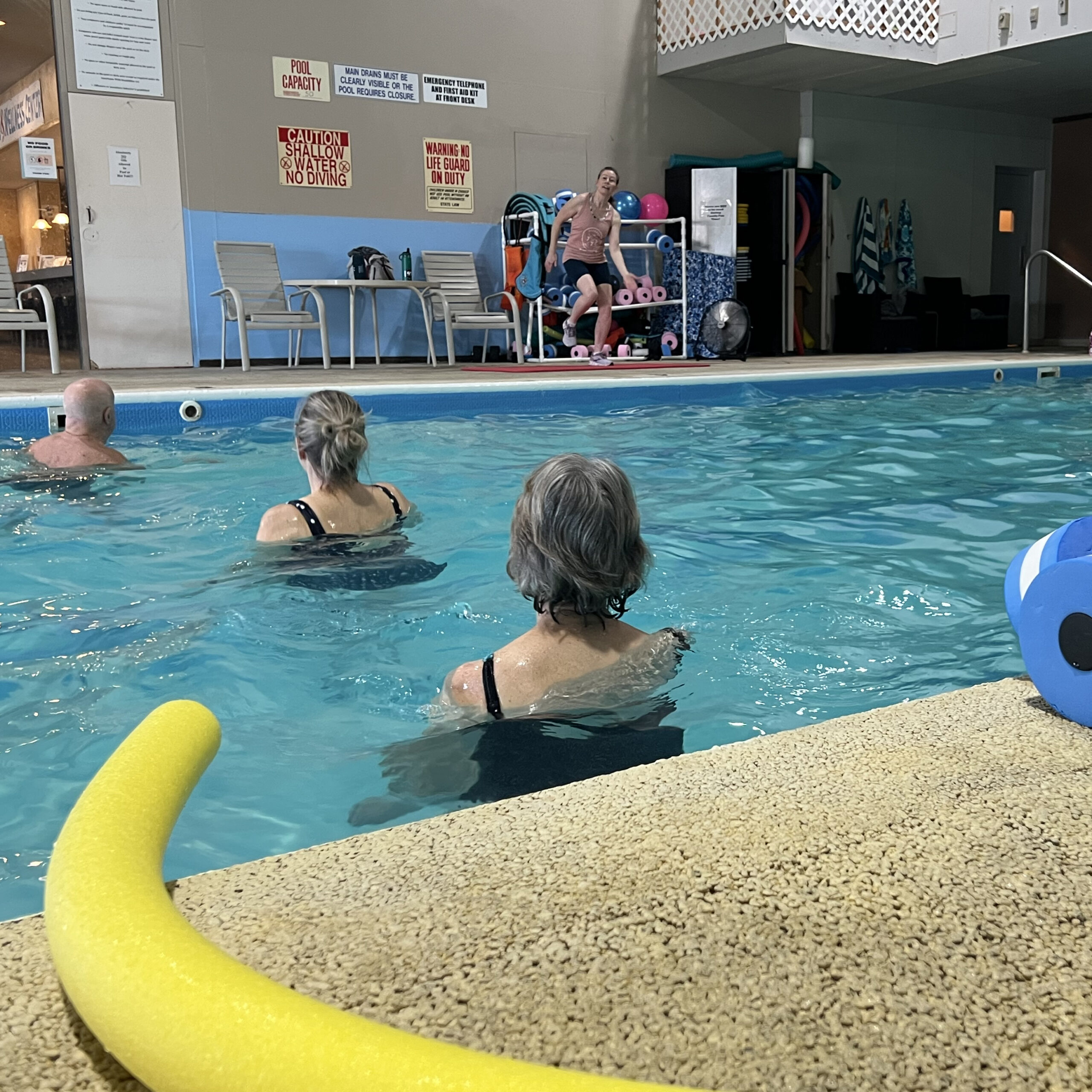 Group aqua fitness classes in the pool area